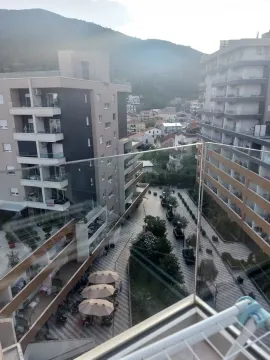View from the terrace towards the surrounding buildings and neighborhood. - image 8
