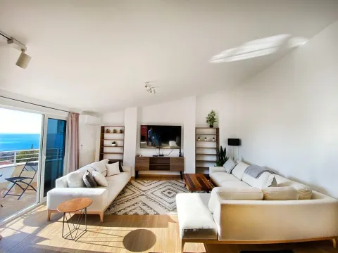 Spacious and bright living room with seating furniture and a sea view. - image 10