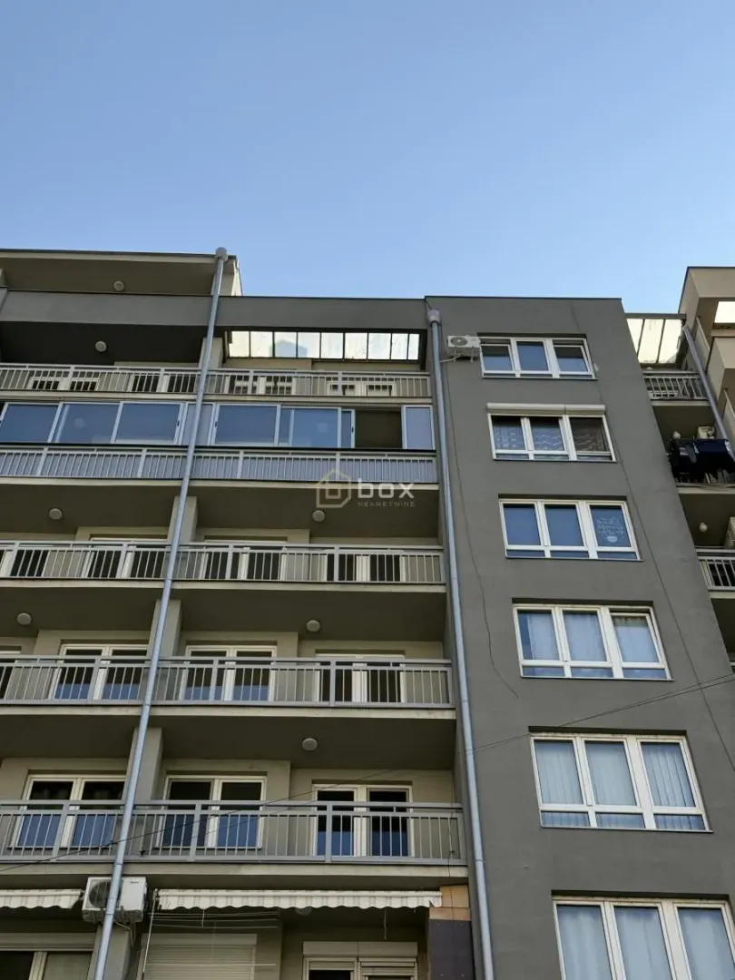 Exterior view of a residential building with balconies.