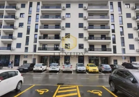 Exterior view of a modern residential building with parking. - image 10