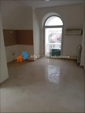 Empty room with tiled floor and access to the terrace. - image 2