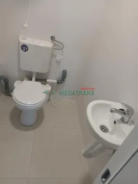 Smaller bathroom with a toilet and a sink. - image 2