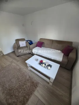 Living room with a sofa set and a coffee table. - image 7