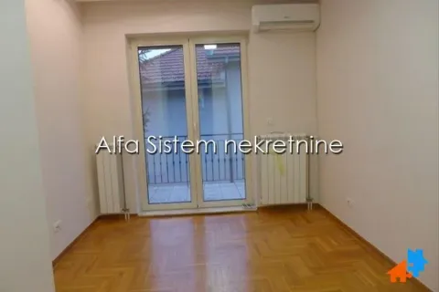 Empty room with hardwood flooring and access to the terrace. - image 13