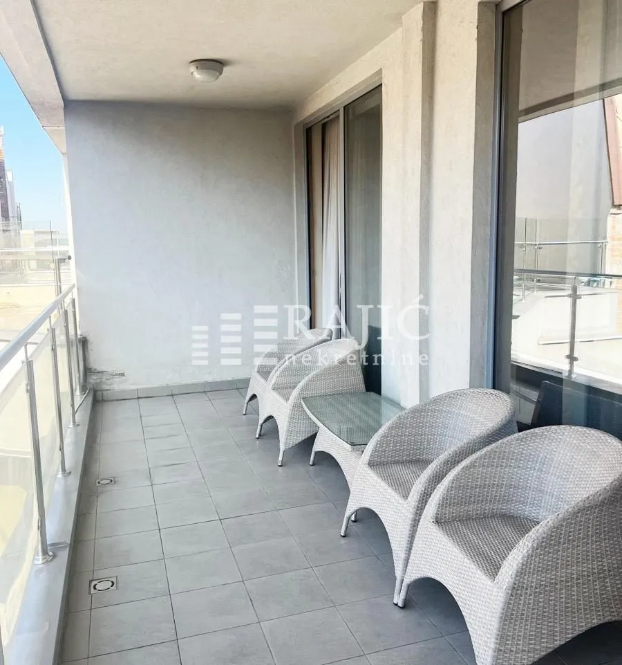 Spacious terrace with seating furniture.