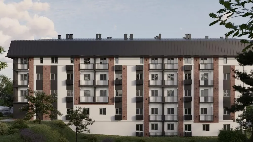Spoljašnji izgled stambene zgrade sa terasama i uređenom okolinom.