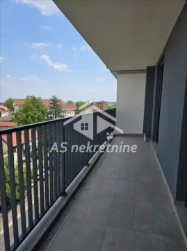 Spacious covered balcony with metal railing and surrounding view. - image 11