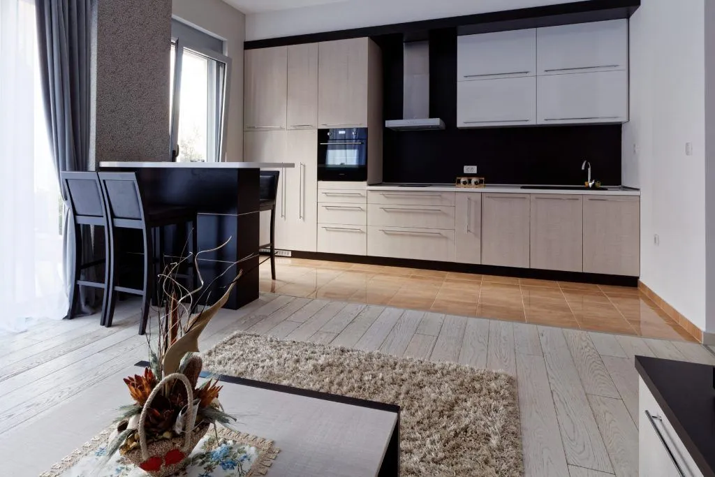 Modern kitchen with a breakfast bar and dining area.