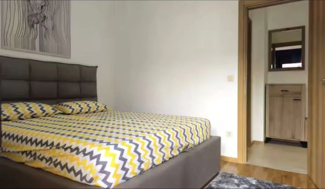 Bedroom with a double bed and a view of the hallway.