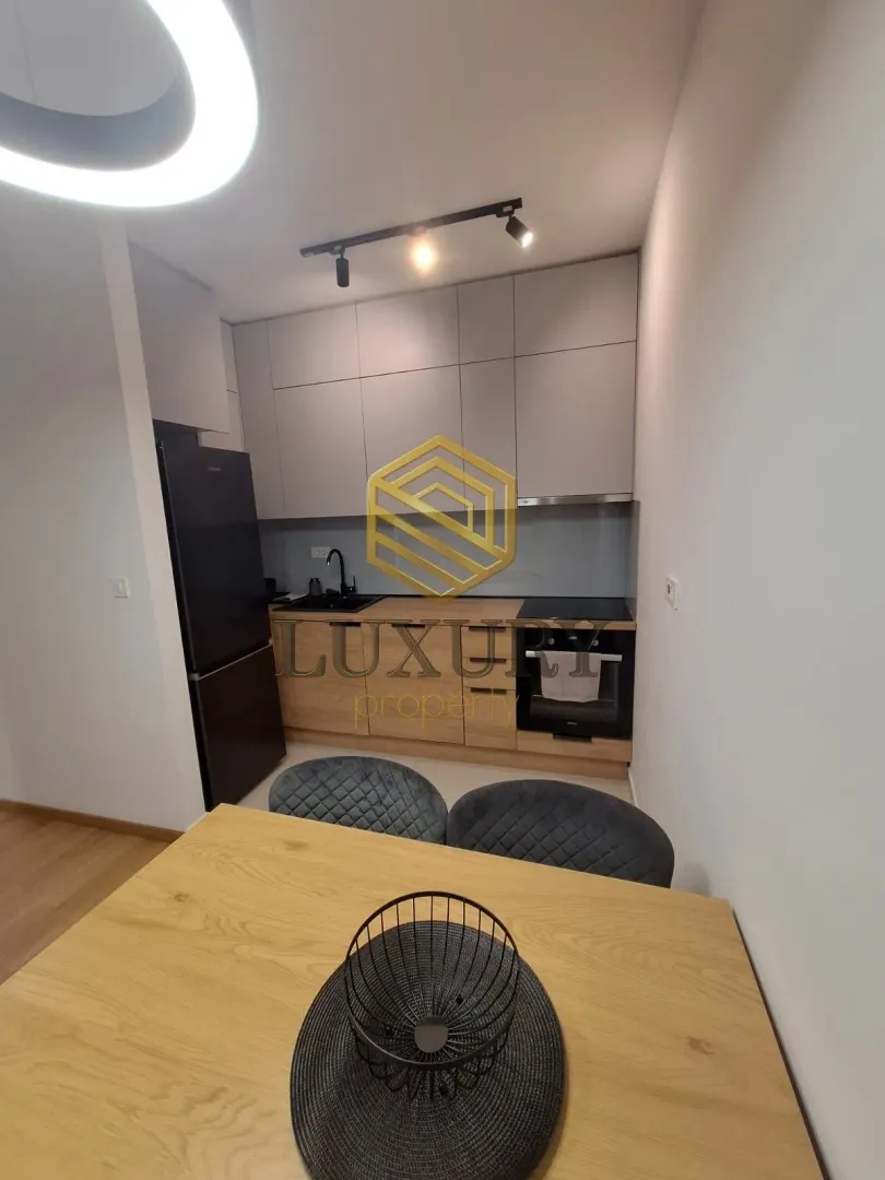 Modern kitchen with a dining table.