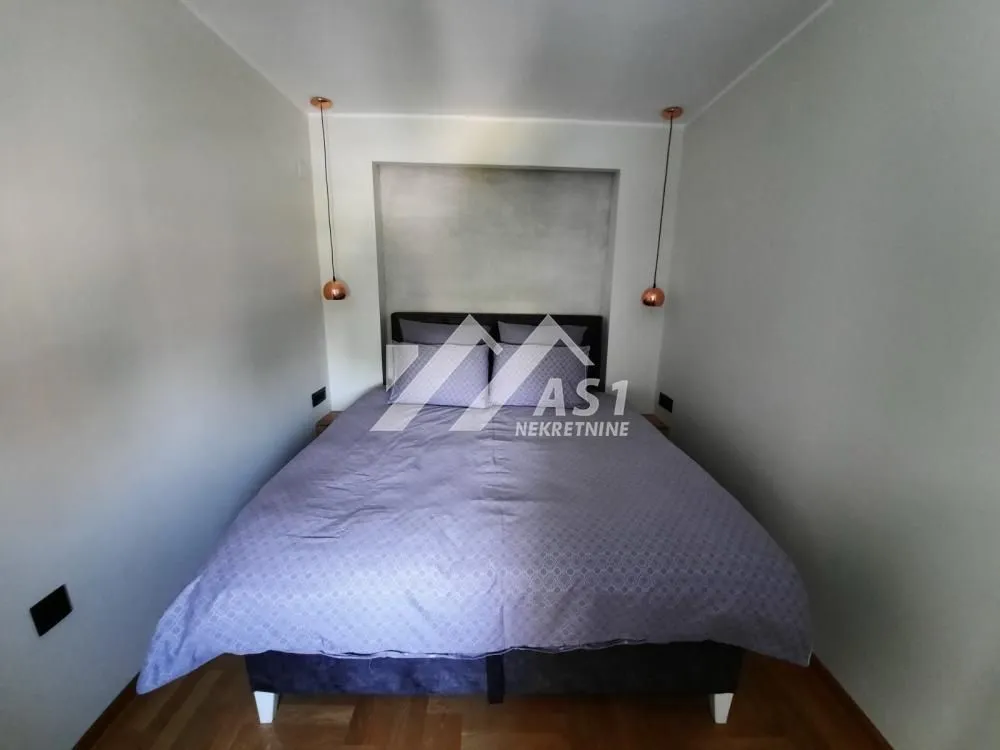 View of the double bed in the bedroom.