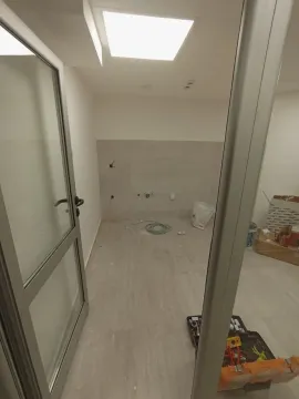 An unfinished room under construction with tools and building materials on the floor. - image 10