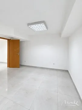 Empty room with light floor tiles and white walls. - image 2