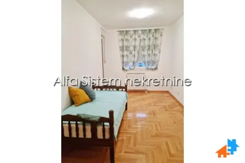 Small bedroom with a bed and parquet flooring. - image 11