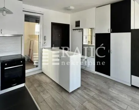 Modern kitchen with built-in units and dining area. - image 4