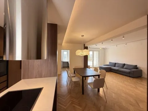 Open-plan space with a kitchen, dining area, and living room. - image 3