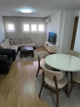 Living room with a seating set and a dining table. - image 5