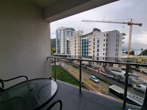 View from the balcony overlooking the city street and surrounding buildings. - image 2