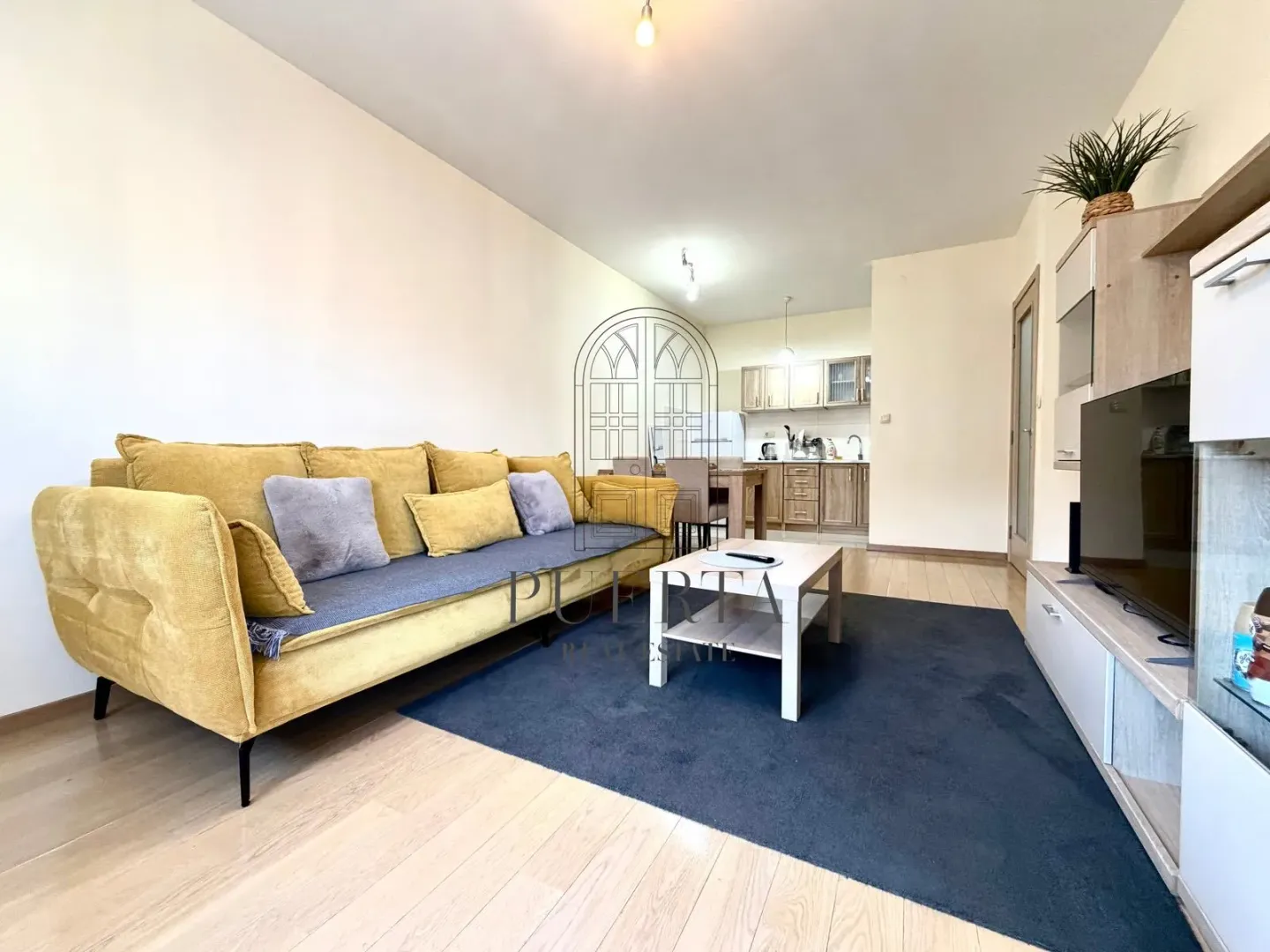 Living room connected with dining area and kitchen.