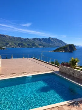 Swimming pool on an open terrace with sea and mountain views. - image 7