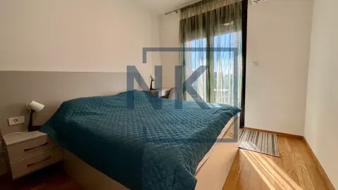 Furnished bedroom with a double bed, bedside table, and access to the terrace. - image 8