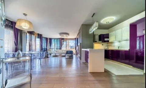 Spacious living room with kitchen and dining area in a modern apartment. - image 3