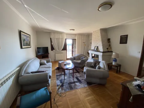 Spacious living room featuring a fireplace and a seating area. - image 2
