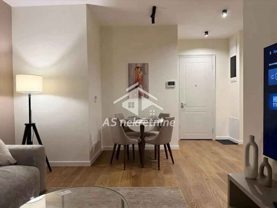 Living room with a dining table and chairs.