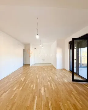 Empty room with parquet flooring and access to the terrace. - image 4