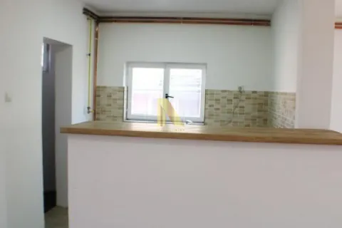 View of a part of the kitchen with a counter and a window. - image 8