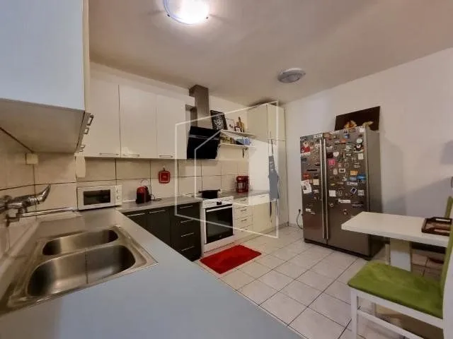 Fully equipped kitchen with a dining table.