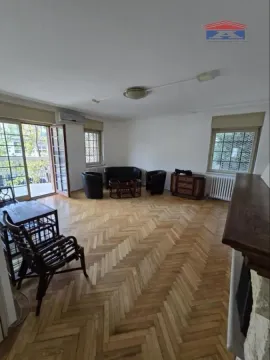 Spacious living room with parquet flooring and access to the terrace. - image 4