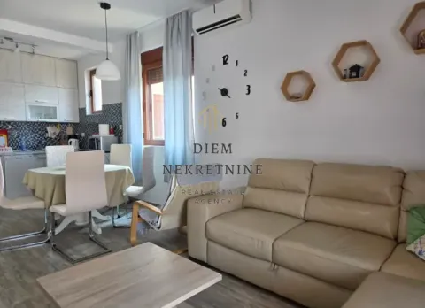 Living room connected to the dining area and kitchen. - image 2
