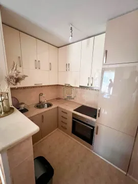 Small kitchen with fitted cabinets and appliances. - image 7