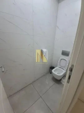 Small bathroom with sanitary ware and light tiles. - image 8