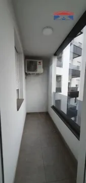 Narrow, enclosed balcony with floor tiles and an external air conditioning unit. - image 12