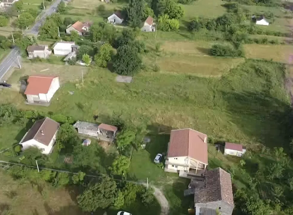 Aerial view of houses and spacious plots.