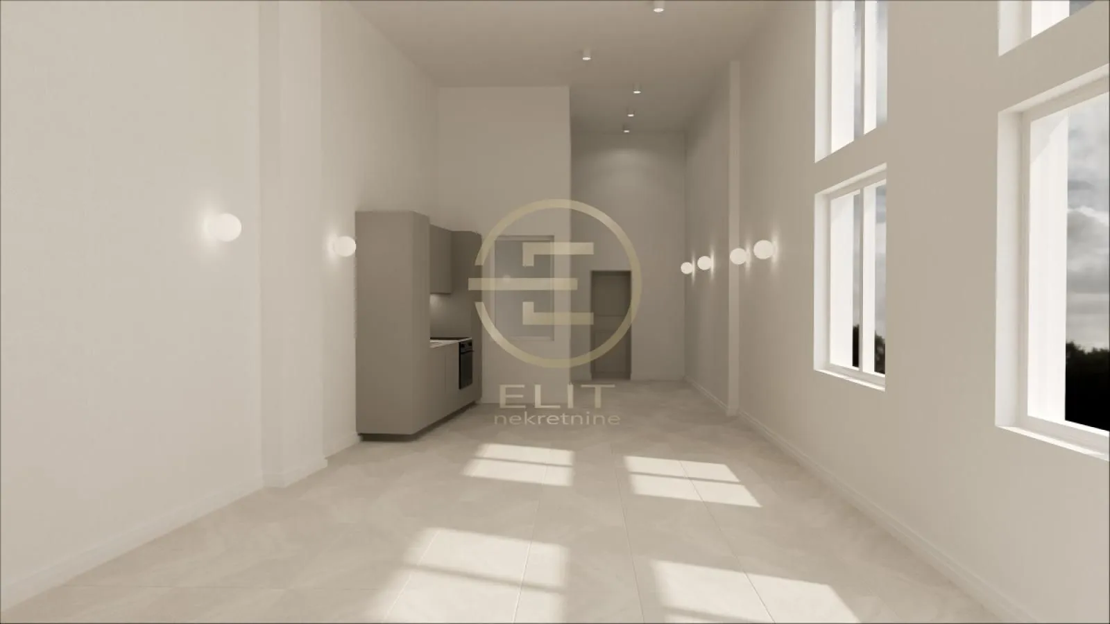 Modern kitchen within a spacious interior featuring large windows.