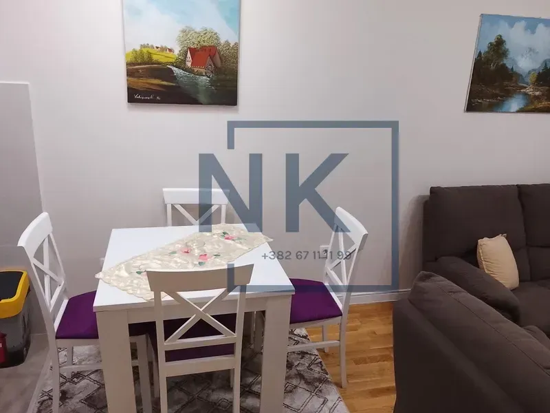 Living room with a dining table and chairs.