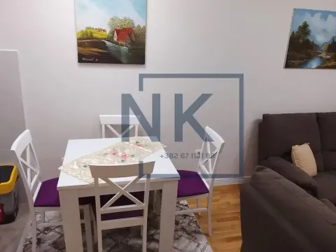 Living room with a dining table and chairs. - image 3