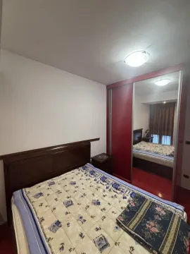 A bedroom featuring a double bed and a built-in wardrobe with a mirror. - image 6