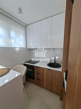 Modern kitchen with white and wooden elements. - image 3