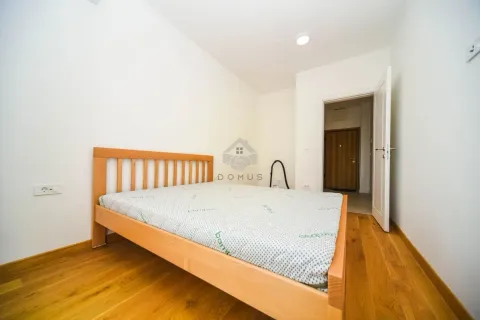 Small bedroom with a wooden bed and parquet flooring. - image 7