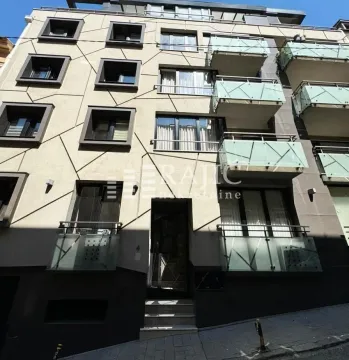 Facade of a modern multi-family building with balconies. - image 11