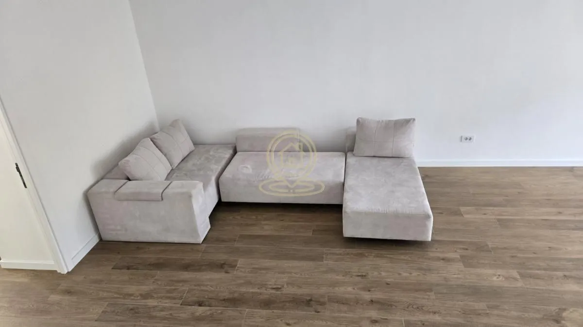 Bright living room with a modular corner sofa.