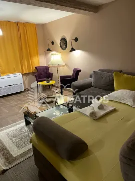 Living room with a sofa, armchairs, and a coffee table. - image 2