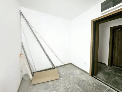 Empty room with floor tiles and construction material. - image 5