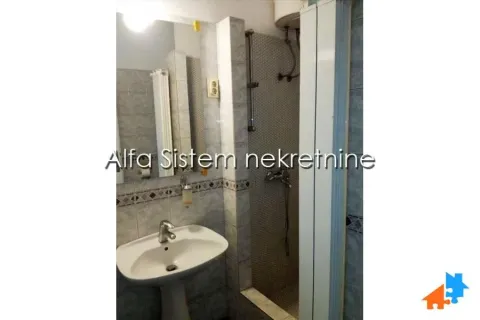 Smaller bathroom with a washbasin, mirror and shower cabin. - image 10