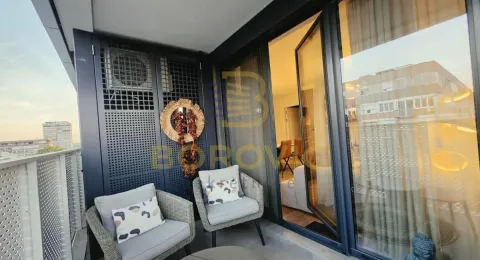 Furnished balcony with seating set and city view. - image 3