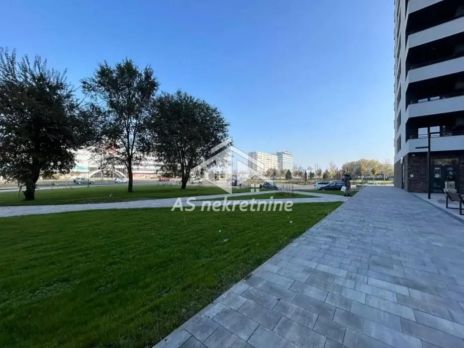 View of the green area in front of the residential building.